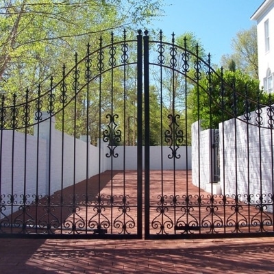 Cast-Iron-Gate-white-brick-house